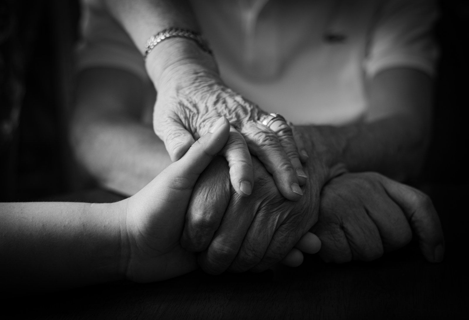 Two hands held with care