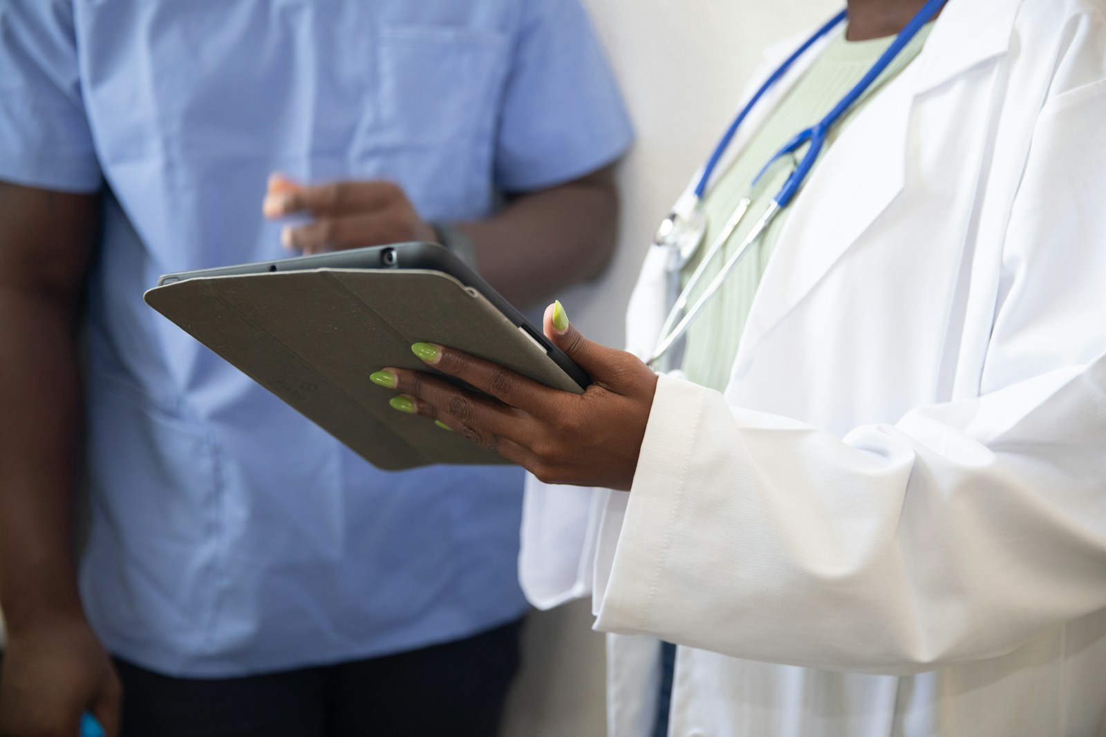A clinician reviewing wound data on a tablet